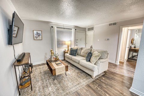 a living room with a couch and a coffee table